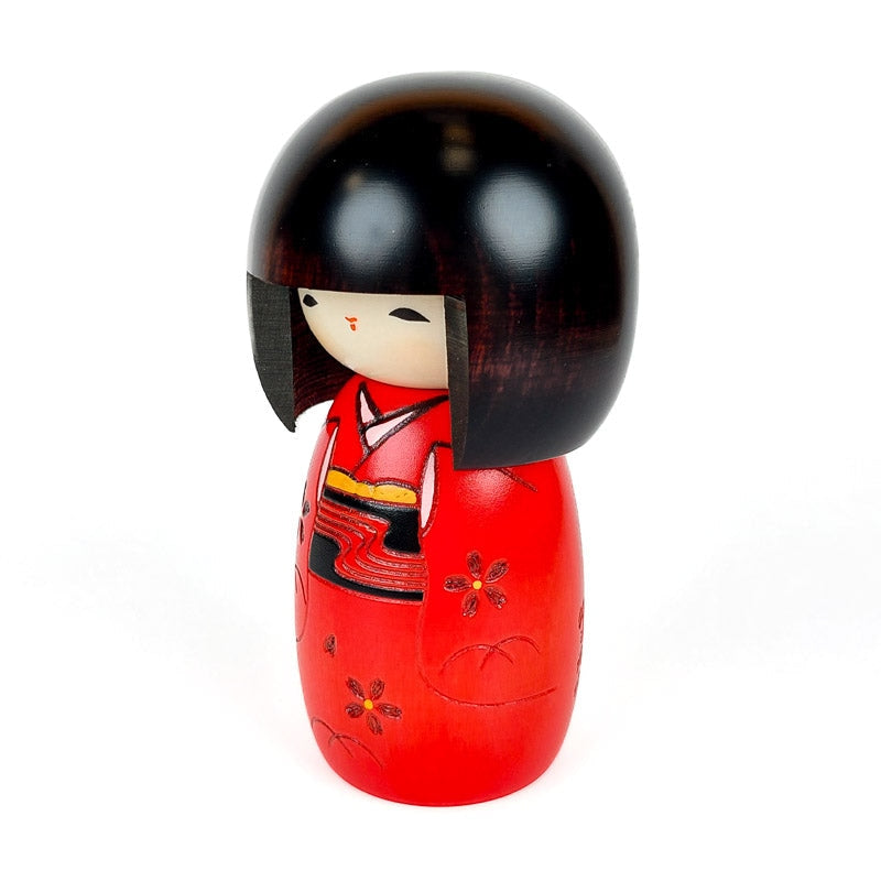 Rød Kokeshi-dukke