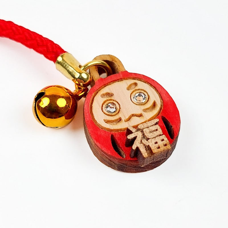 Daruma nøglering i træ