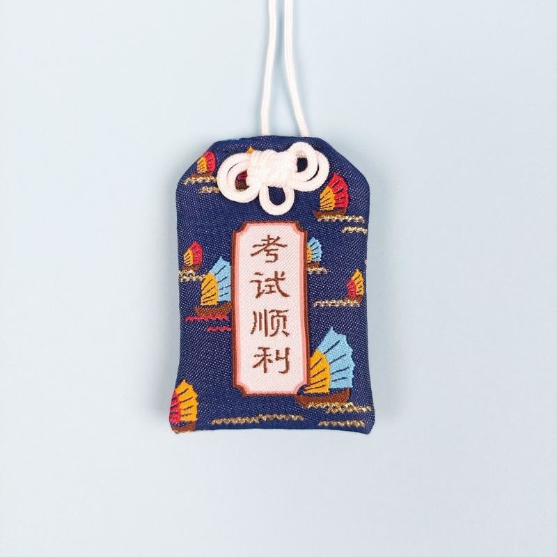 Omamori bestået eksamen