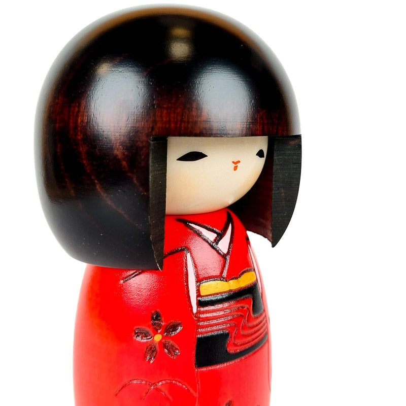 Rød Kokeshi-dukke