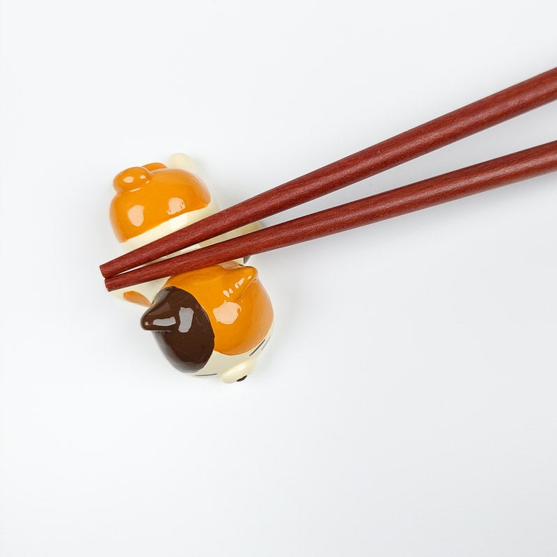 Spisepindeholder til japansk kat